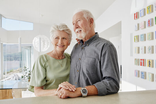 Smiling senior couple in a luxury villa