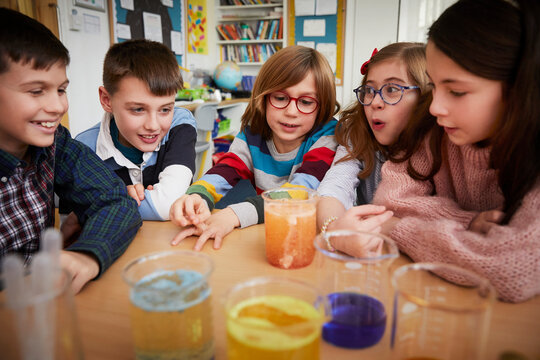 Group of children in a science chemistry lesson