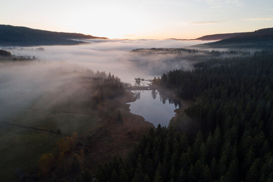 Germany, Baden-Wurttemberg, Drone view of&Ocirc;&oslash;&Omega;Schluchsee&Ocirc;&oslash;&Omega;lake shrouded in thick fog at sunrise