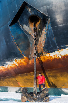Portrait of man posing on top of anchor of ice-breaker 50 Years of Victory