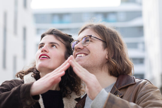 Happy Couple Making House Shape With Hands