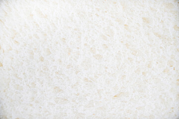 the closeup look of sliced white bread as a food background pattern. a detailed food texture for any creative design.
