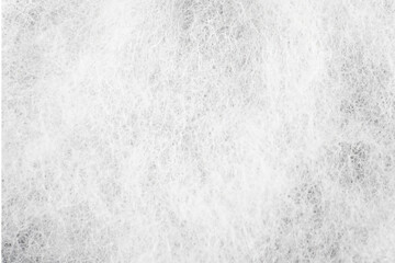 the detailed view of artificial cotton in white. the uneven texture of synthetic material for a...