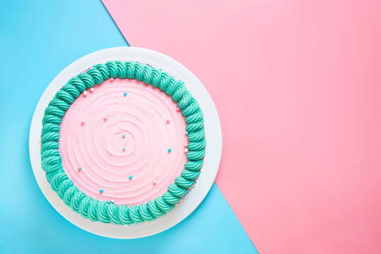 Studio shot of pink birthday cake