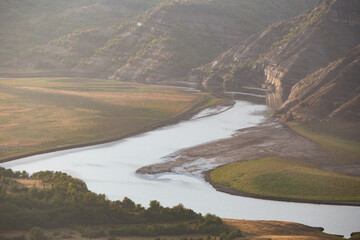 Scenic view of a river surrounded by mountains