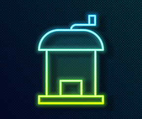 Glowing neon line Manual coffee grinder icon isolated on black background. Vector