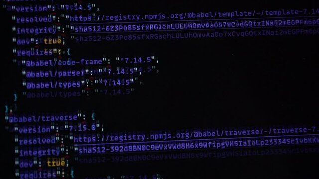Computer blue code running over black screen of laptop