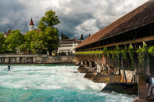 Historic ridge over Aare river against cloudscape in Thun, Switzerland