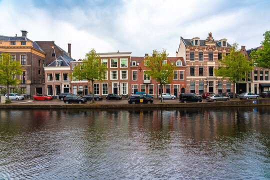 Netherlands, North Holland, Haarlem, Parked cars and historic houses along Binnen Sparne canal