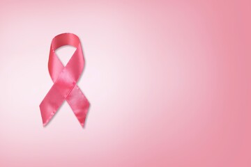 Pink ribbon on pastel background, Breast cancer awareness concept