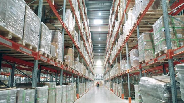 Passage between storehouse stacks with boxes