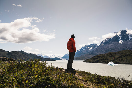 Man standing and admiring view of Grey Glacier at Torres Del Paine National Park, Patagonia, Chile, South America
