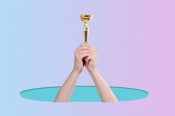 Hand of human holding gold winner cup, award and victory concept.