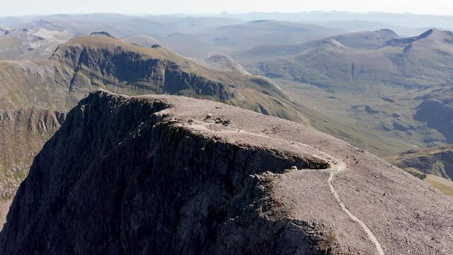 Aerial view of hikers on the summit of Ben Nevis - the tallest mountain in the United Kingdom