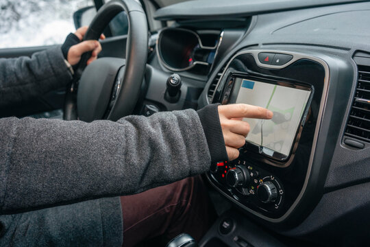 Man using navigational map while sitting in car