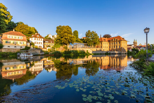Germany, Bavaria, Bamberg, Villa Concordia and surrounding houses reflecting in river Regnitz