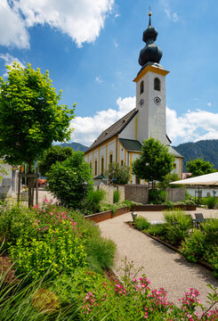 Germany, Bavaria, Inzell, Town square in front of Saint Michael church in summer