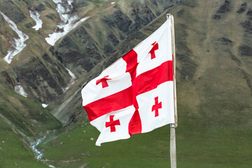 Georgia, Svaneti, Ushguli, Georgian national flag fluttering outdoors