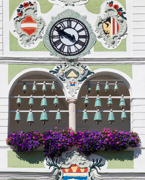 Flowers and bells with clock on town hall, Gmunden, Salzkammergut, Upper Austria, Austria