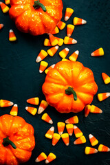 Halloween pumpkin and candy corn banner on blue baclground. Top view with copy space