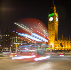 Beautiful shot of Big Ben at night with street lights in London
