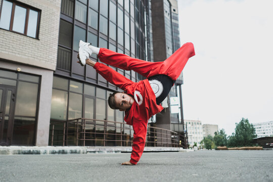 a bboy break dance freeze outdoors, hip hop movement
