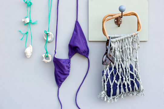 Strings with seashells, bikini and DIY macrame bag with bamboo handles