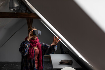 Happy young woman wearing VR glasses