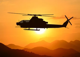 Zelfklevend Fotobehang American attack helicopter silhouette in the flight © filmbildfabrik