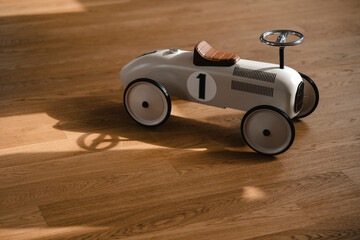 Toy car on wooden floor
