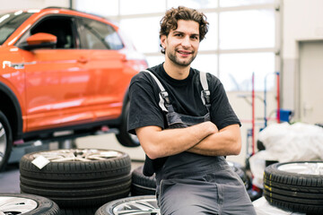 Portrait of a smiling car mechanic in a workshop