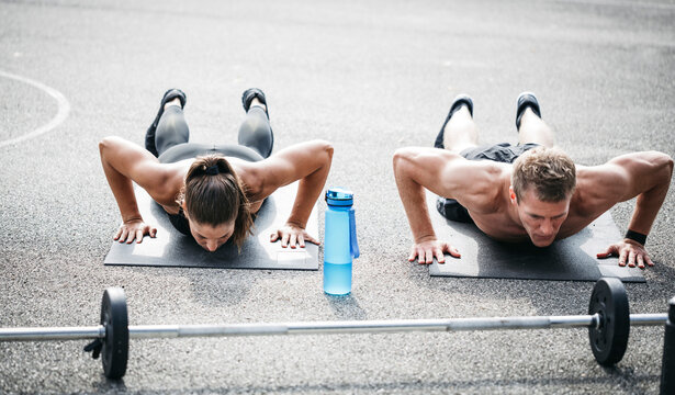 Sportive man and woman during pushups