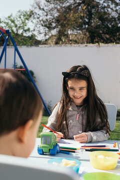 Kids coloring in garden