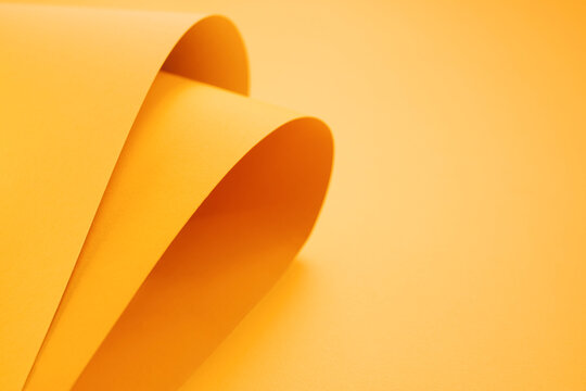 Orange folded papers as background