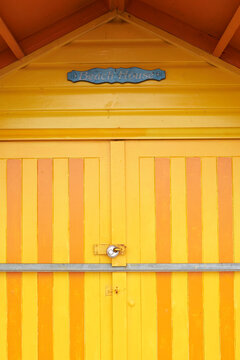 Colorful yellow door of a beach house