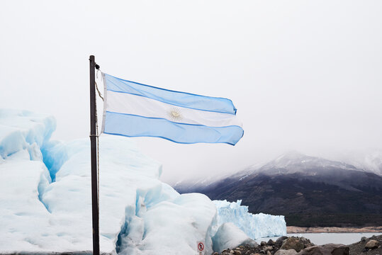 Argentina, Patagonia, Argentinan flag at Perito Moreno Glacier