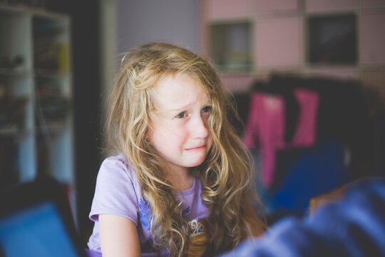 Portrait of a crying girl at home