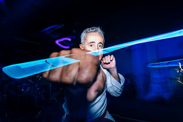 Composite of senior man practicing karate