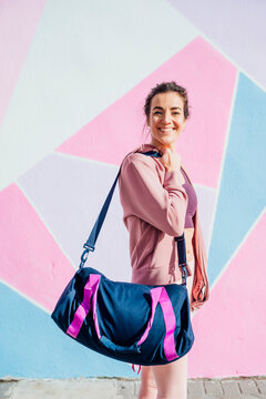 Sportive Woman With Sports Bag Looking At Camera