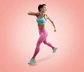 Fototapeta na wymiar Smiling young fitness model in sportswear doing exercise