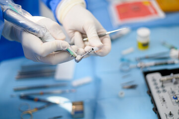 Dentist surgeon showing an implant