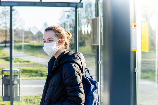 Portrait Of A Girl With Mask Waiting At Bus Stop