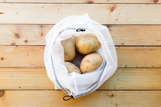 Potatoes in shopping satchet