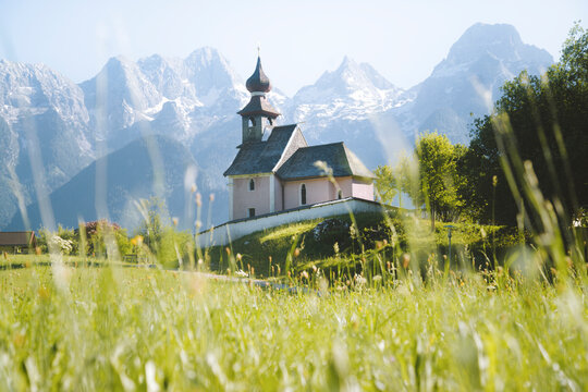 Austria, Salzburg Land, Lofer, Au church with Lofer mountains in background in springtime