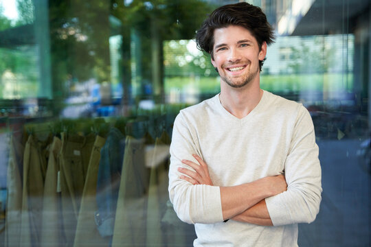 Portrait of happy casual businessman in the city