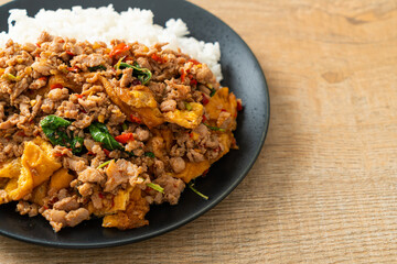 stir-fried minced pork with basil and egg topped on rice