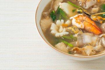Wide Rice Noodles with Seafood in Gravy Sauce