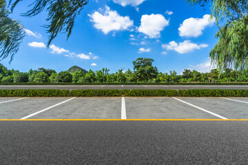 Empty parking lot with trees in the distance