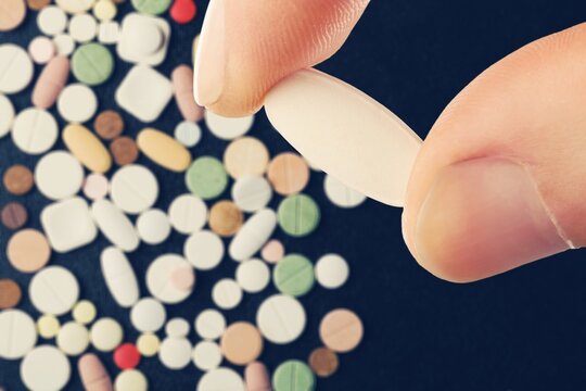 Collection of pill medication on table medical concept