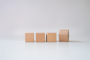 Wooden cubes in row. It is isolated on a white background